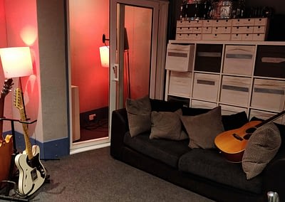 A view back to the sofa, vocal booth and storage in Studio B of Bamm-Bamm Music Ltd.